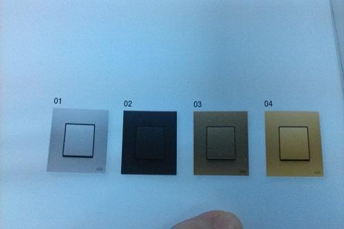 欧悦 millenium 系列开关,从左到右颜色依次为不锈钢,丝绸黑,古典金和